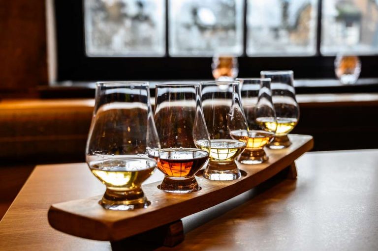 A row of whisky glasses ready for tasting